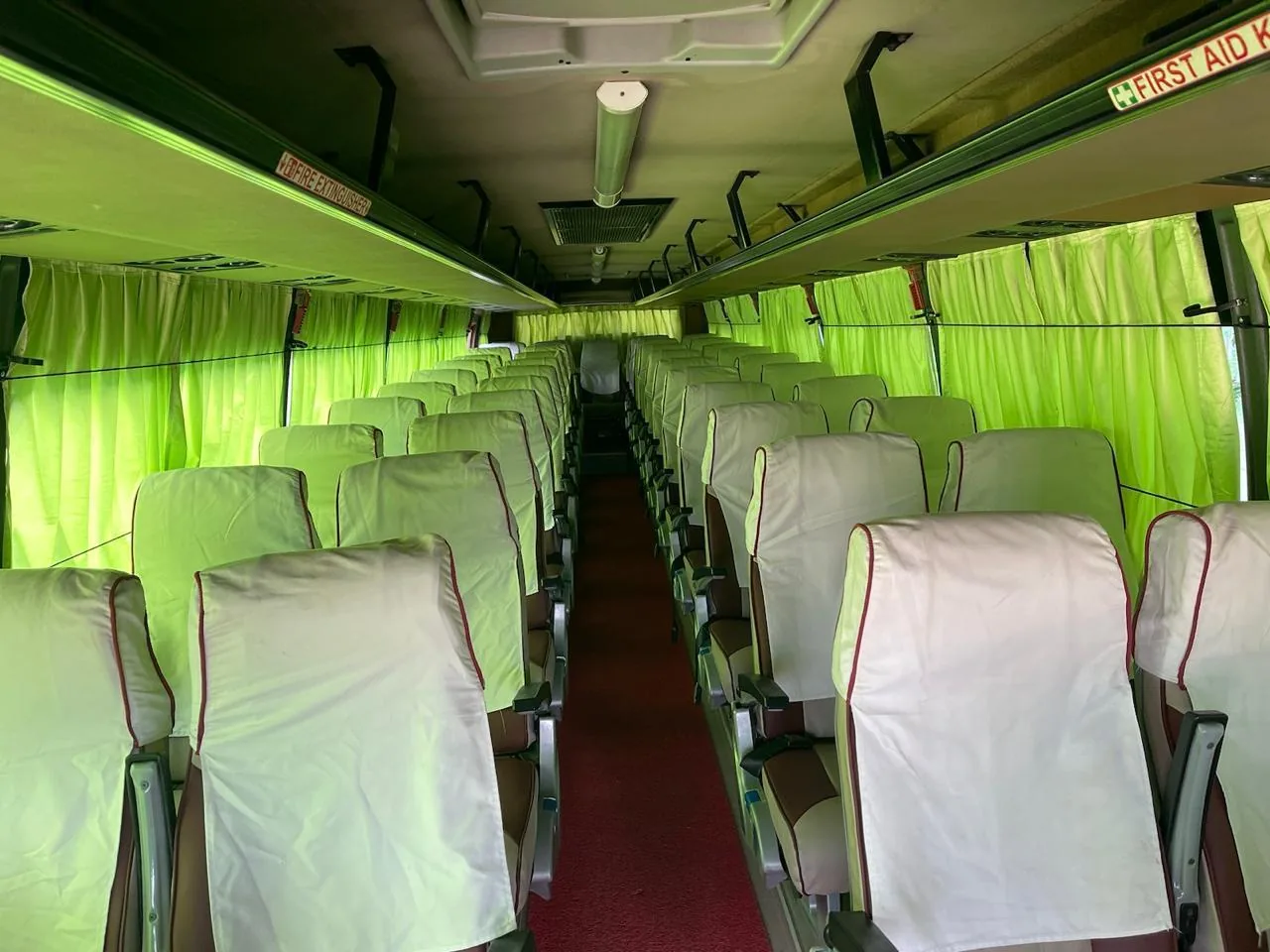 Clean bus interior for group travel in Hyderabad